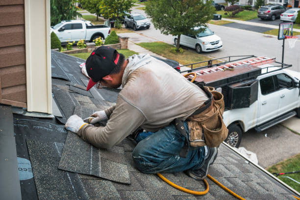 Professional Roofing technician working in Kingsford Heights, IN